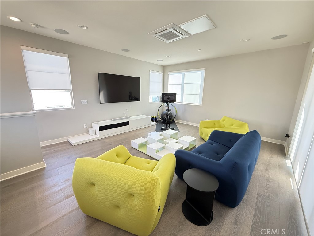 101 Interval Irvine, CA 92618 - Photo 13 of 20 a living room with furniture and a flat screen tv