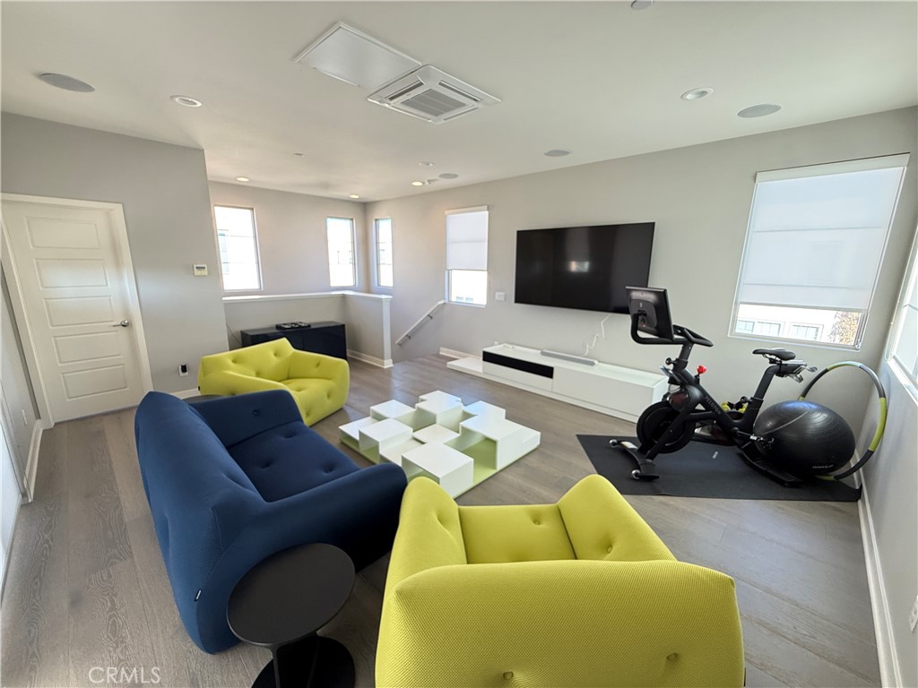 101 Interval Irvine, CA 92618 - Photo 14 of 20 a living room with furniture and a flat screen tv