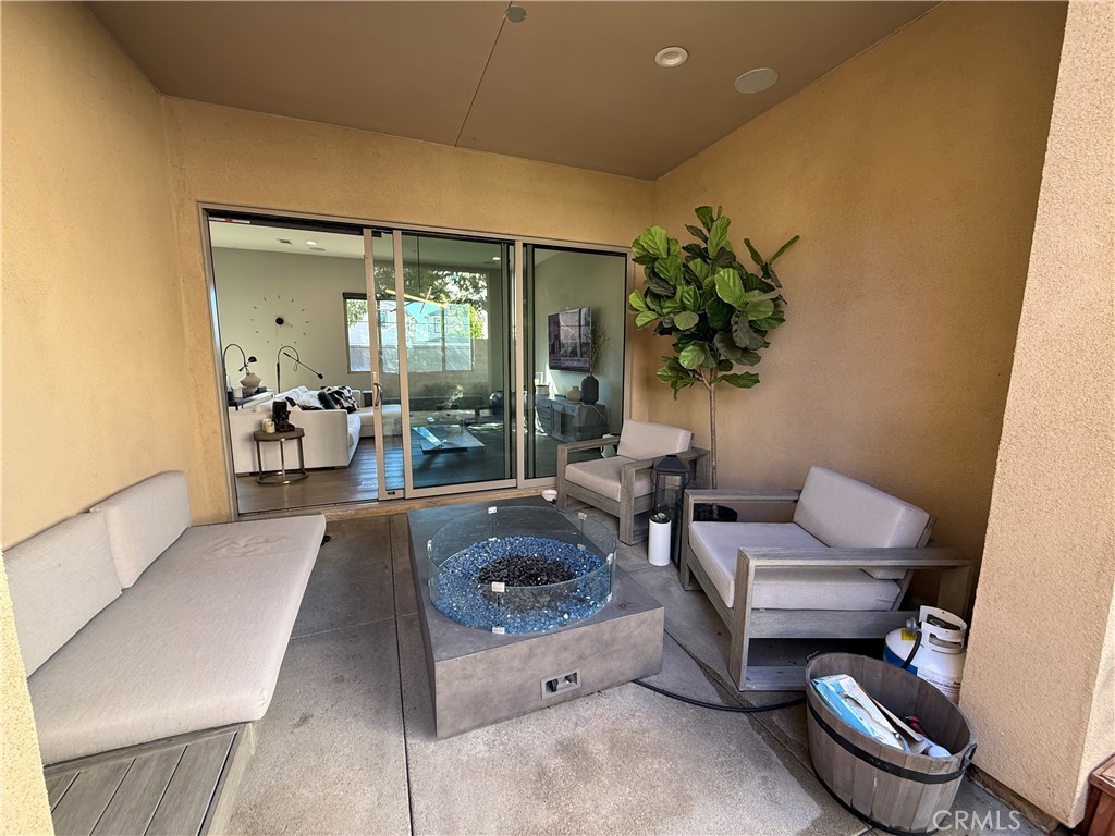 101 Interval Irvine, CA 92618 - Photo 17 of 20 a living room with furniture and a potted plant