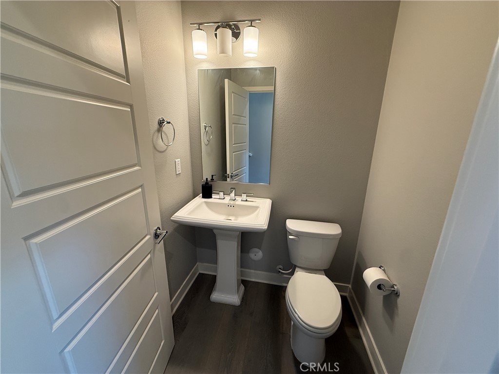 101 Interval Irvine, CA 92618 - Photo 5 of 20 a bathroom with a toilet sink and mirror