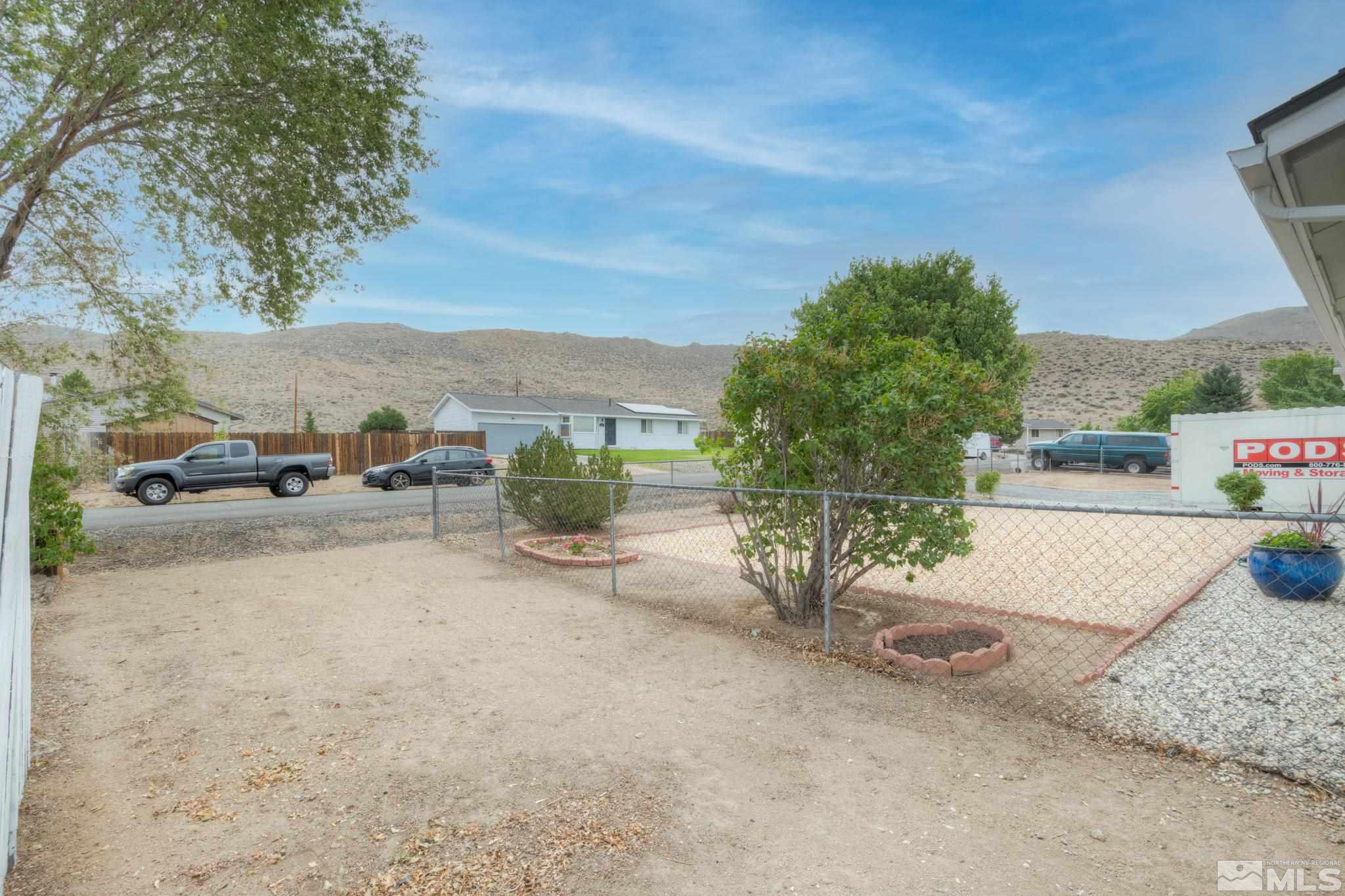 3360 Canvasback Lane Reno, NV 89508 - Photo 13 of 35 a view of a street with cars parked on the roadside