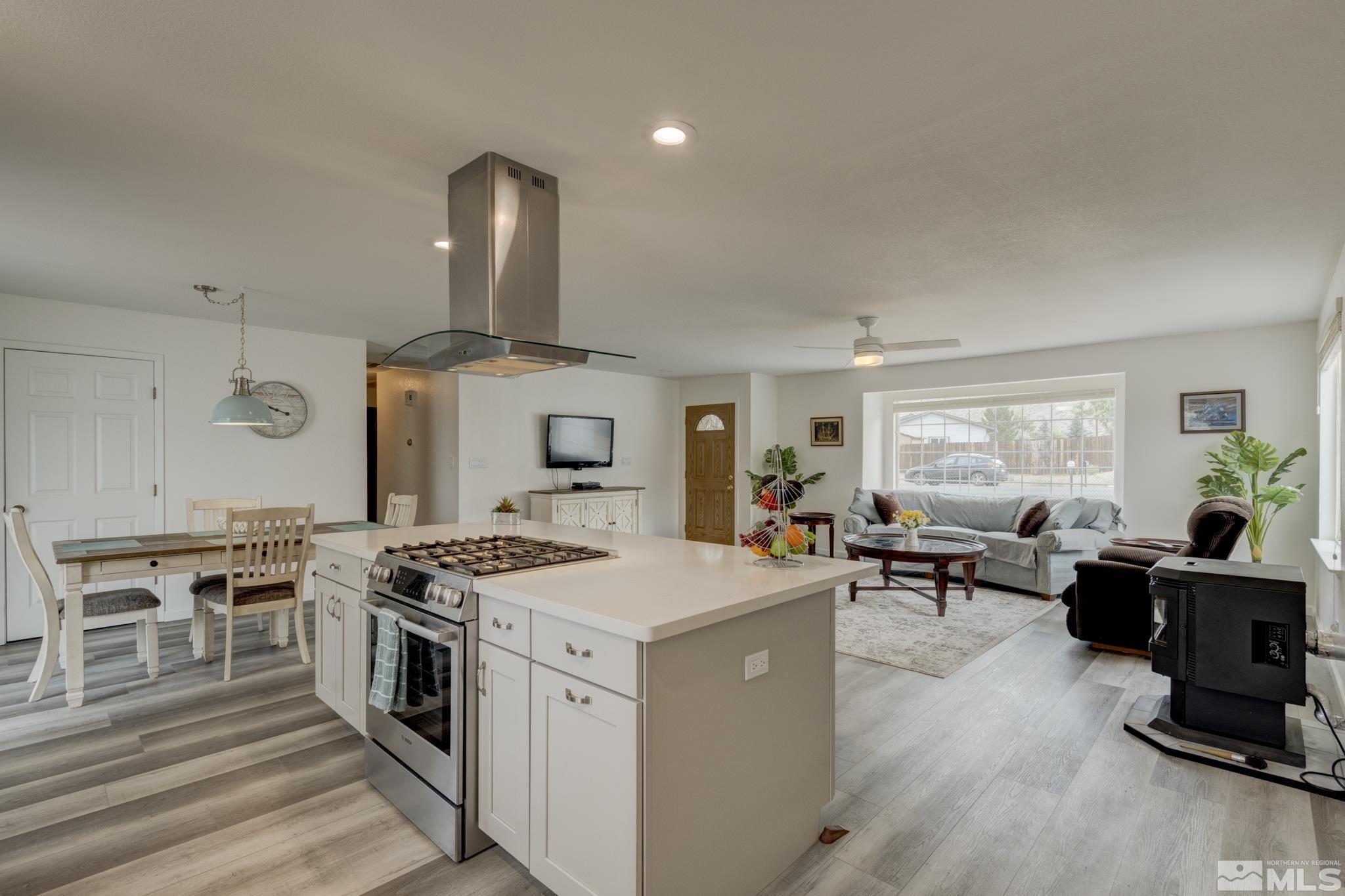 3360 Canvasback Lane Reno, NV 89508 - Photo 17 of 35 a kitchen with stove and chairs