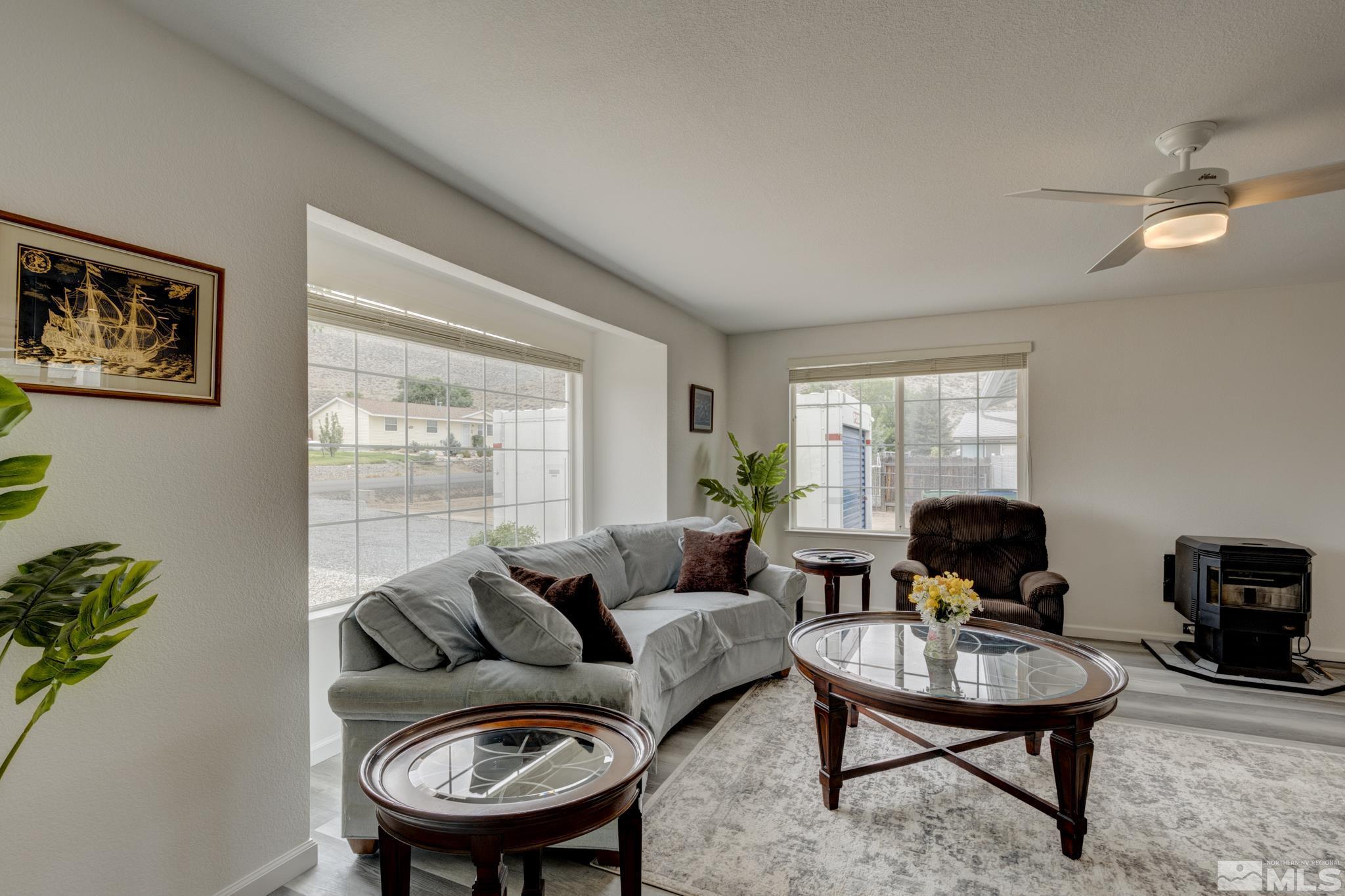 3360 Canvasback Lane Reno, NV 89508 - Photo 2 of 35 a living room with furniture a window and a table
