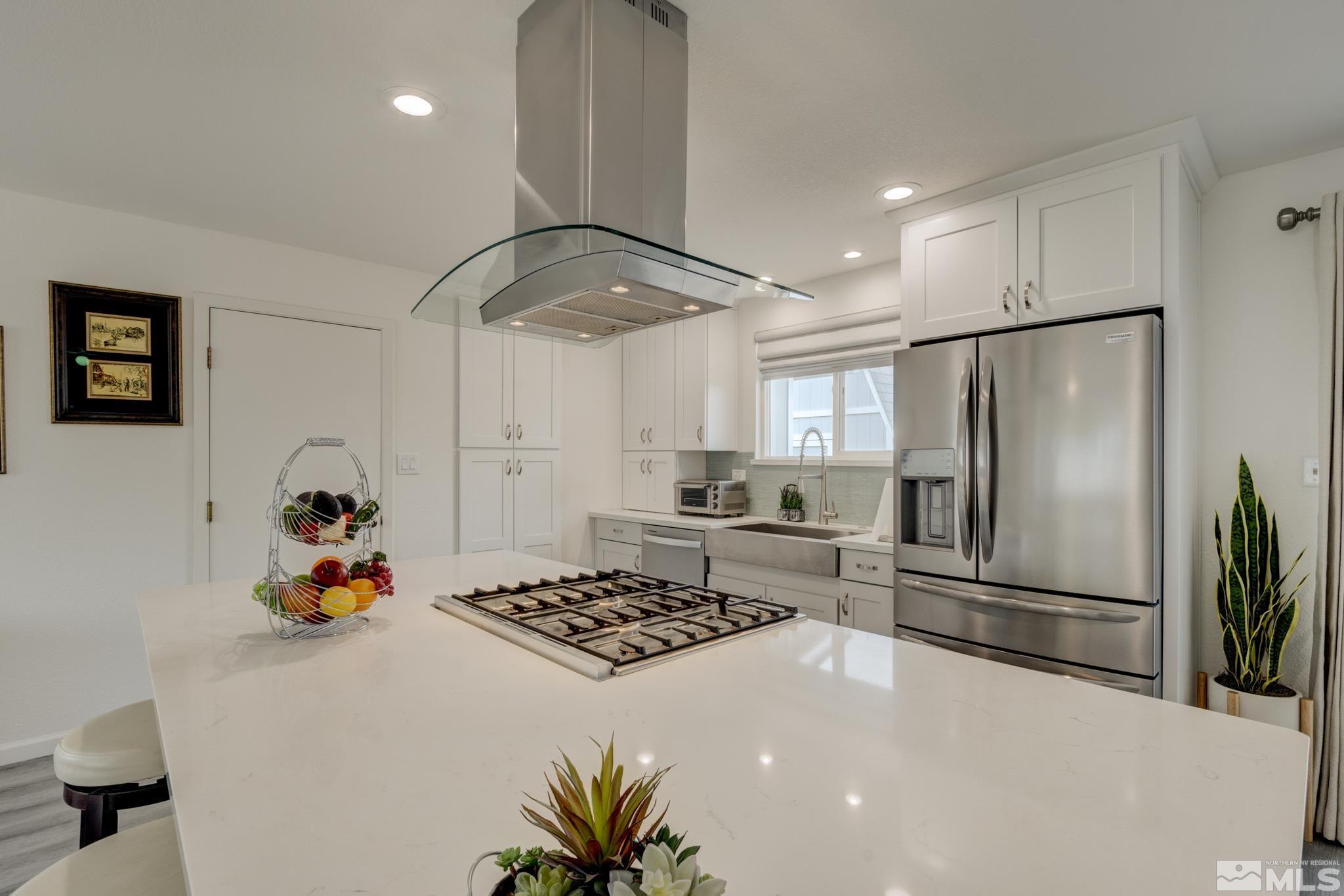 3360 Canvasback Lane Reno, NV 89508 - Photo 22 of 35 a kitchen with a refrigerator and a stove