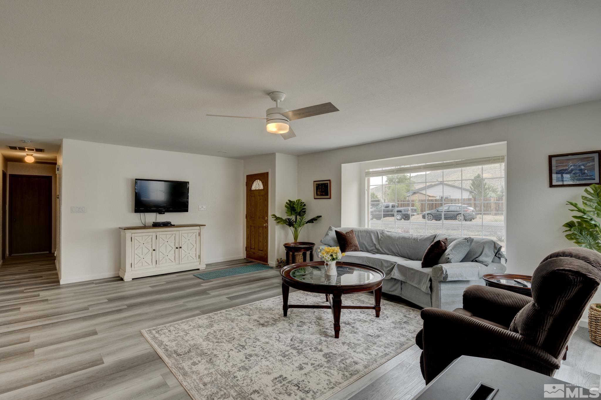 3360 Canvasback Lane Reno, NV 89508 - Photo 5 of 35 a living room with furniture and a flat screen tv