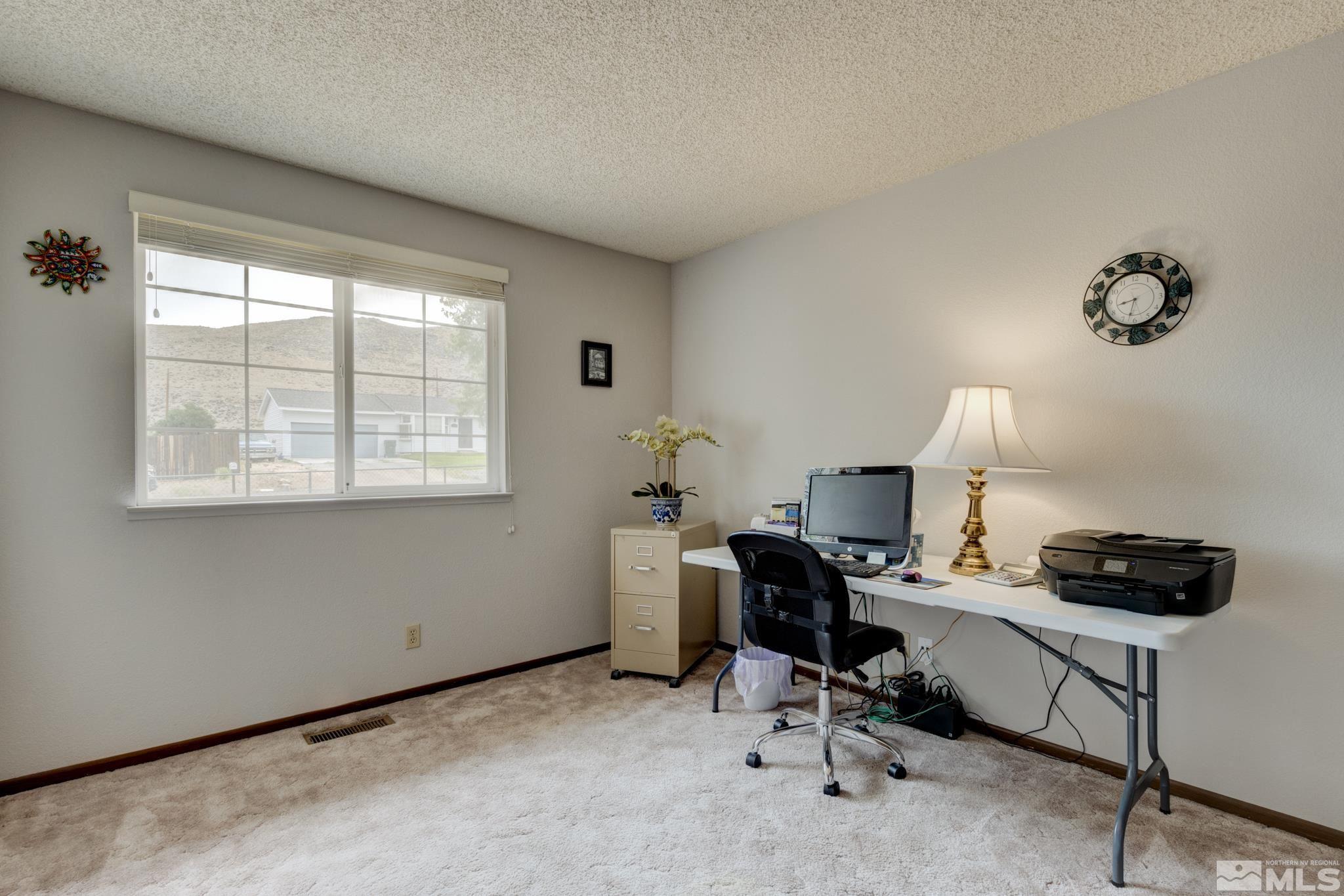 3360 Canvasback Lane Reno, NV 89508 - Photo 8 of 35 a view of a workspace with furniture and a window