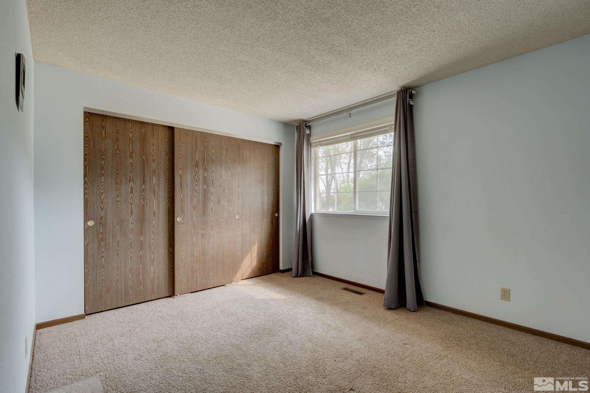 3360 Canvasback Lane Reno, NV 89508 - Photo 10 of 35 a view of an empty room and window