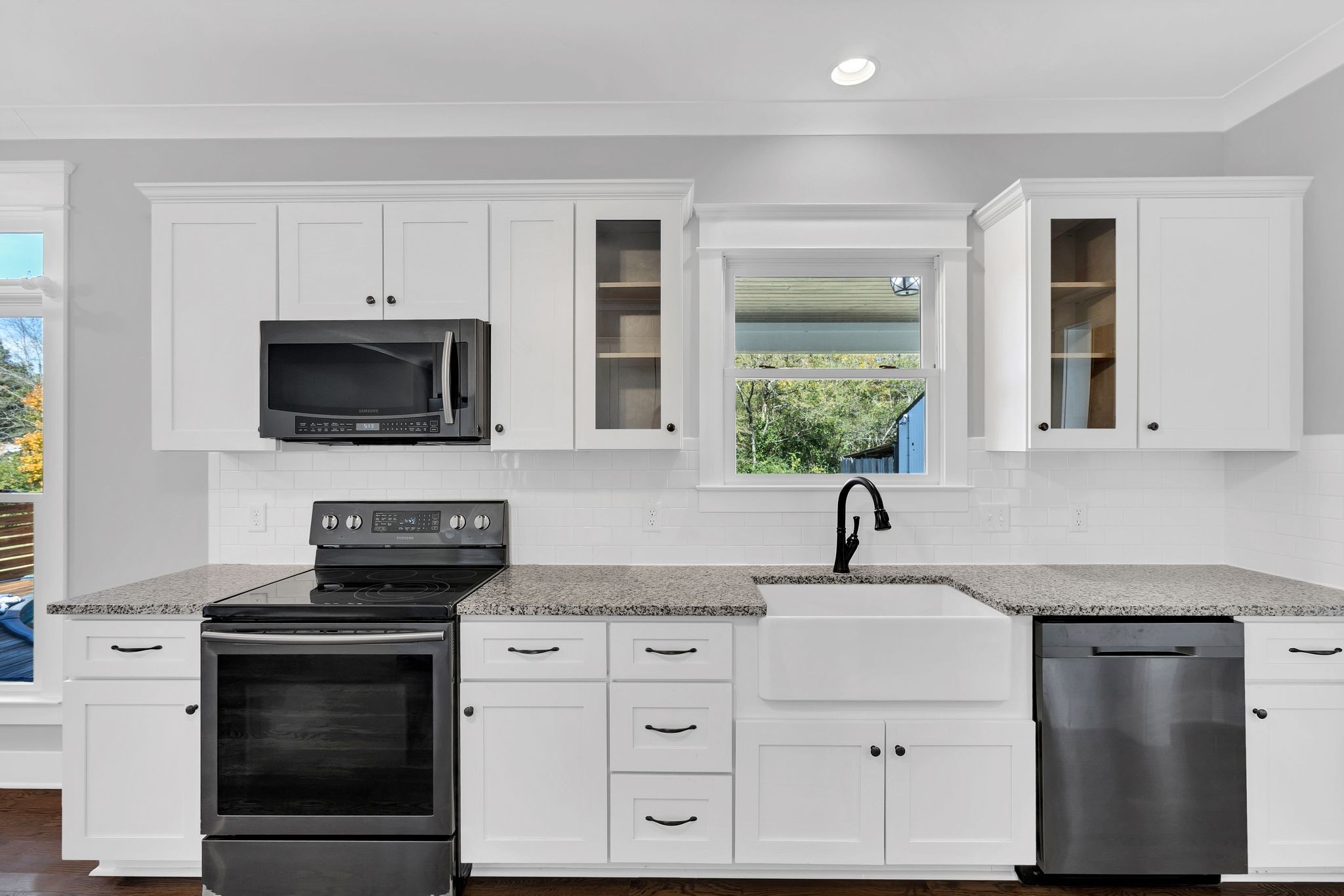 229 Pleasant View Road White Bluff, TN 37187 - Photo 17 of 38 a kitchen with white cabinets and stainless steel appliances