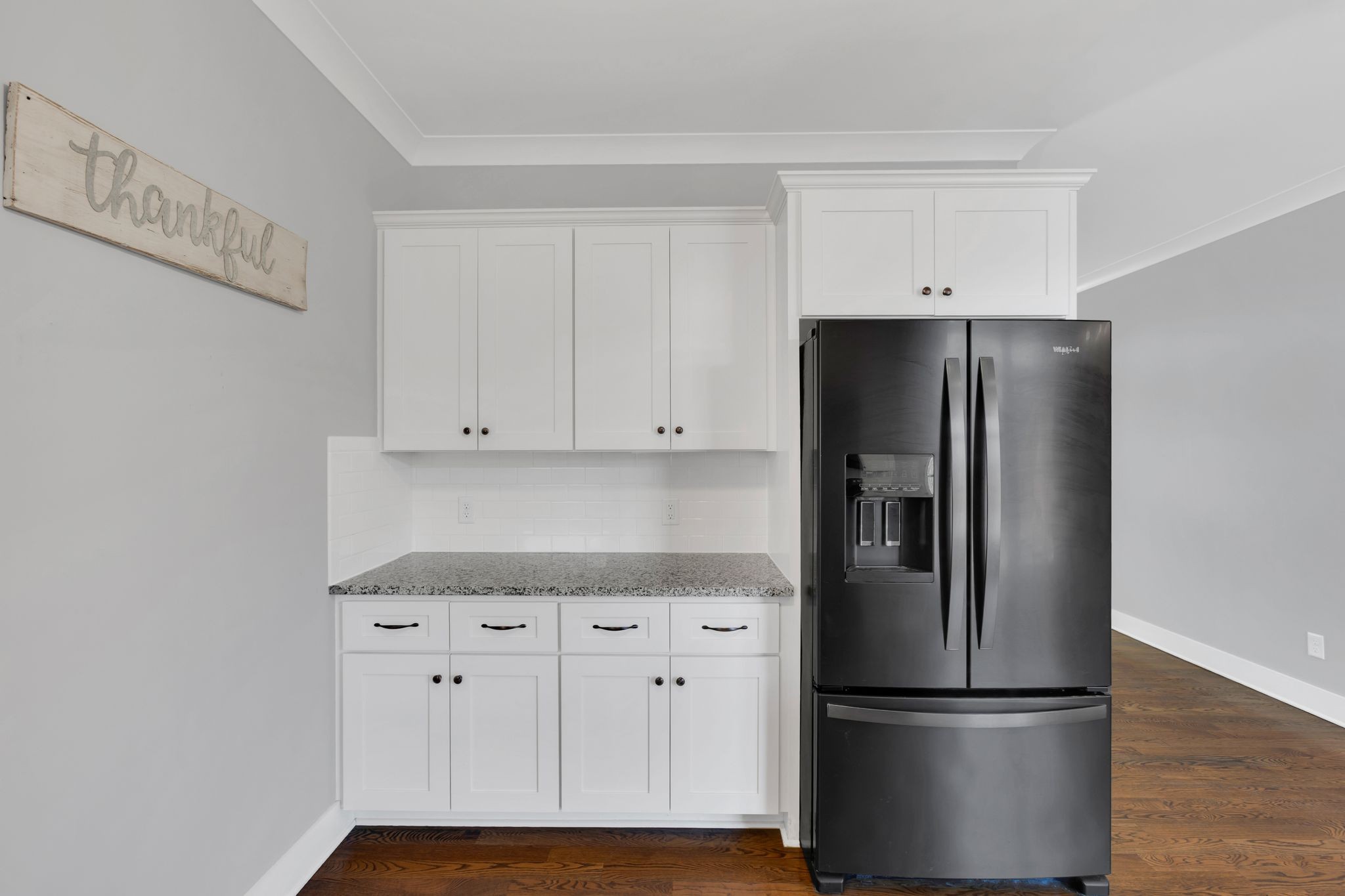 229 Pleasant View Road White Bluff, TN 37187 - Photo 18 of 38 a kitchen with granite countertop white cabinets and stainless steel appliances