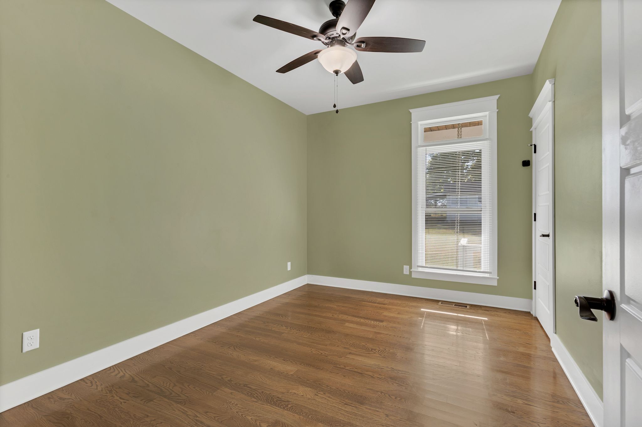 229 Pleasant View Road White Bluff, TN 37187 - Photo 21 of 38 a view of empty room with wooden floor and fan