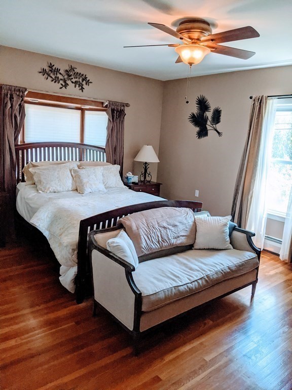 9 Byron Street Wakefield, MA 01880 - Photo 12 of 42 a bedroom with a bed and wooden floor