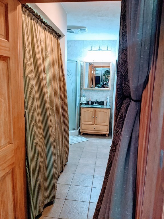 9 Byron Street Wakefield, MA 01880 - Photo 13 of 42 a view of a bedroom with furniture and staircase