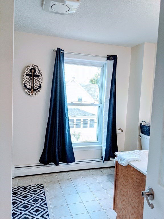 9 Byron Street Wakefield, MA 01880 - Photo 19 of 42 a view of a closet with wooden floor and a window