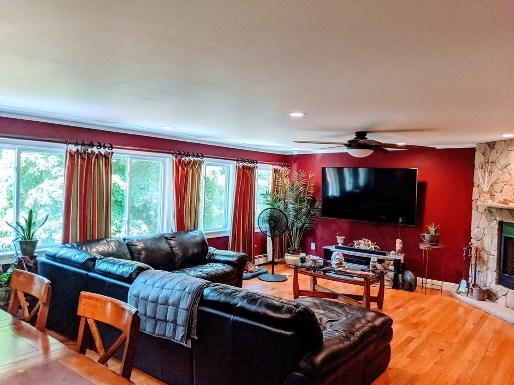 9 Byron Street Wakefield, MA 01880 - Photo 23 of 42 a living room with furniture a flat screen tv and a large window