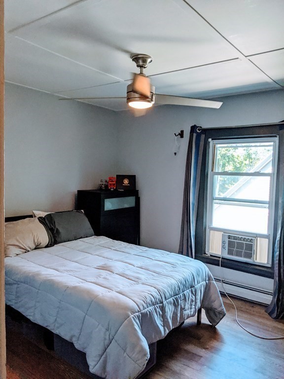9 Byron Street Wakefield, MA 01880 - Photo 27 of 42 a bedroom with a bed and a window