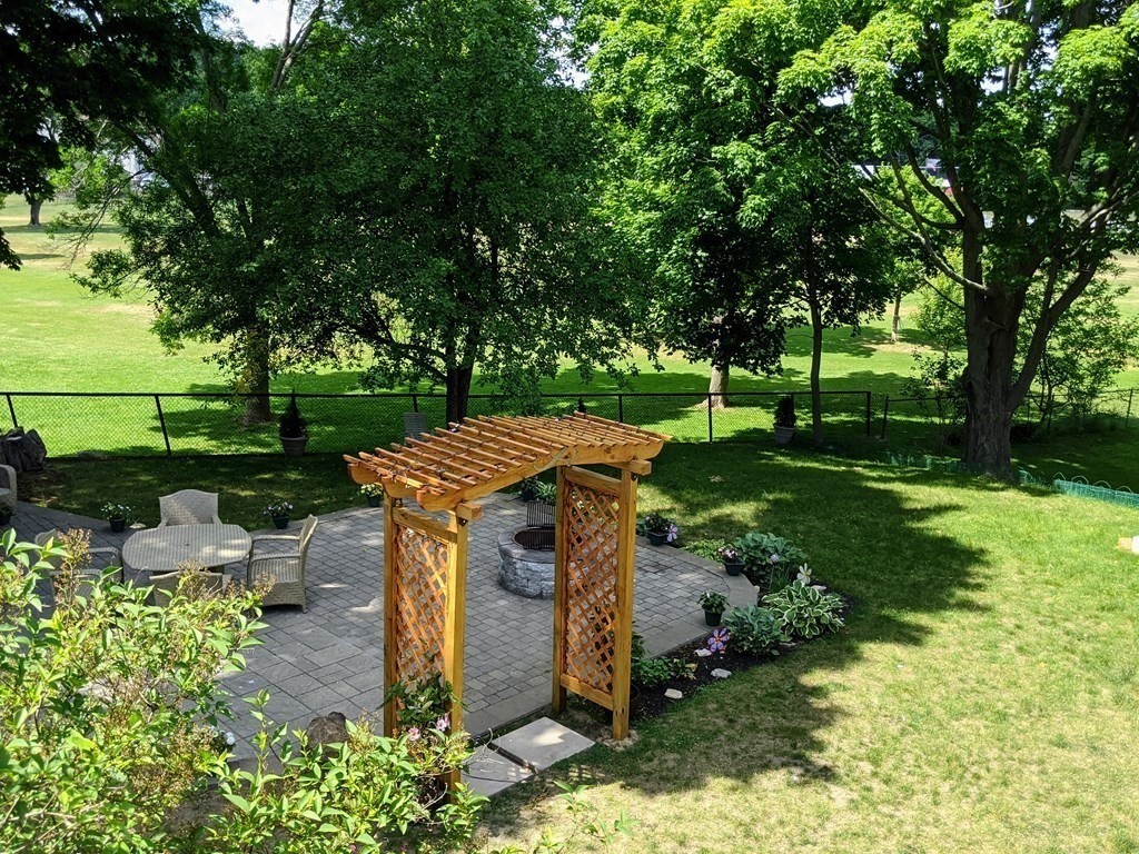 9 Byron Street Wakefield, MA 01880 - Photo 33 of 42 a view of a park with plants and large trees