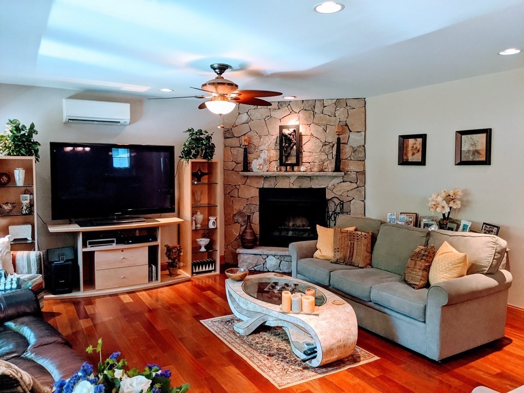 9 Byron Street Wakefield, MA 01880 - Photo 6 of 42 a living room with furniture and a flat screen tv