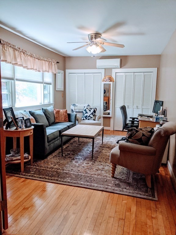 9 Byron Street Wakefield, MA 01880 - Photo 9 of 42 a living room with furniture and a wooden floor