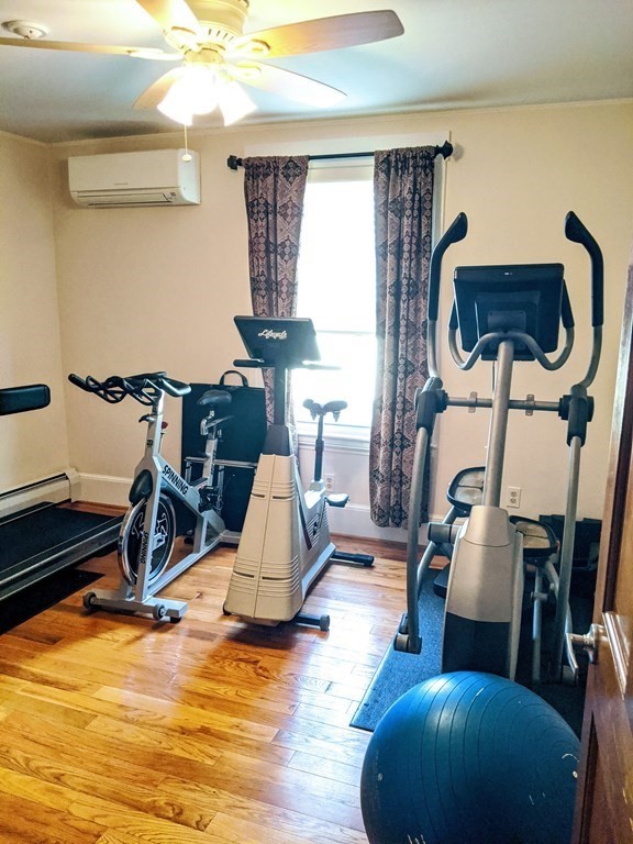 9 Byron Street Wakefield, MA 01880 - Photo 10 of 42 a living room with furniture and a wooden floor