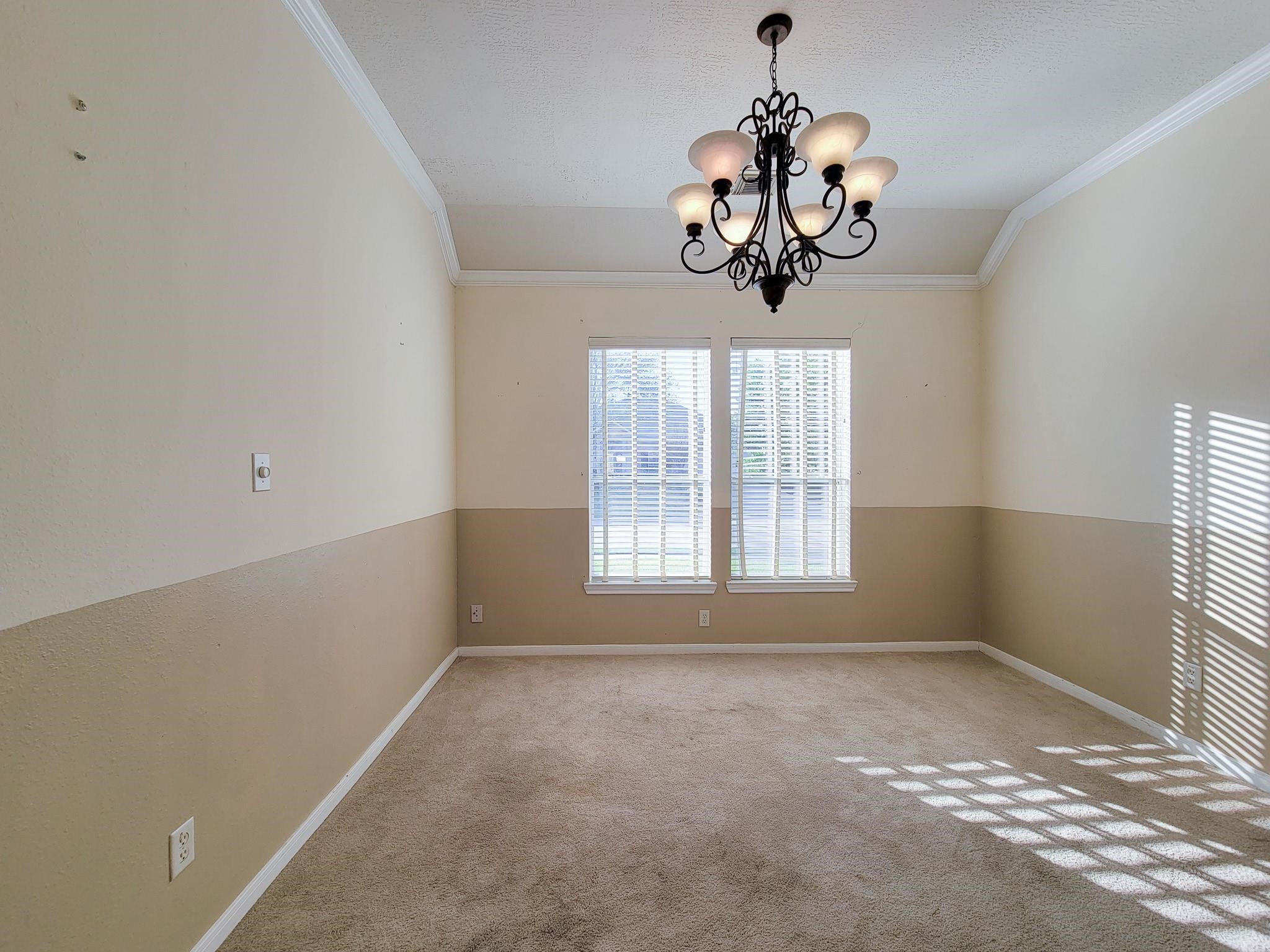 13935 Charterhouse Way Sugar Land, TX 77498 - Photo 17 of 36 a view of a room with a window and a chandelier