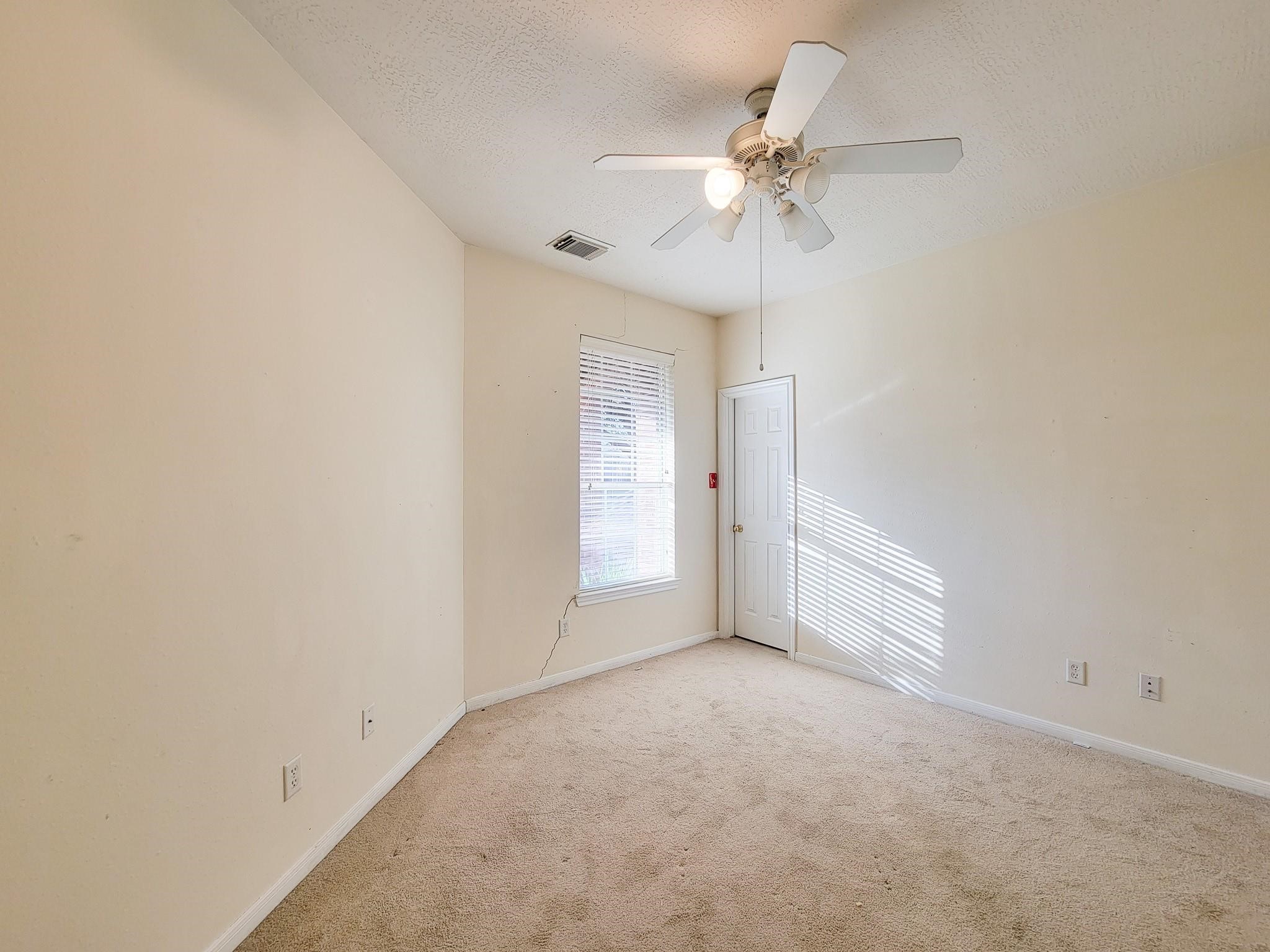 13935 Charterhouse Way Sugar Land, TX 77498 - Photo 25 of 36 a view of an empty room with a window