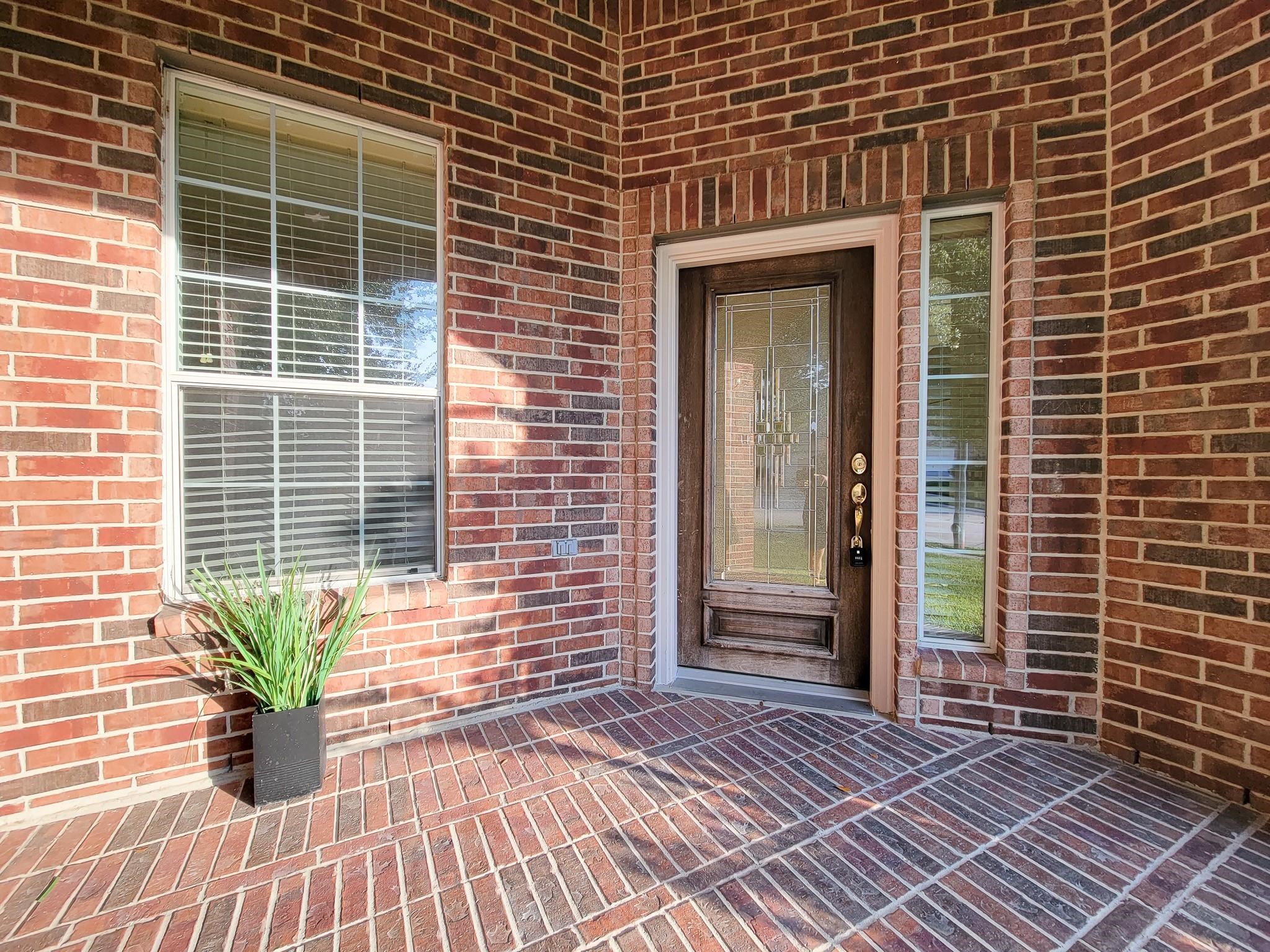 13935 Charterhouse Way Sugar Land, TX 77498 - Photo 3 of 36 a view of a house with a patio