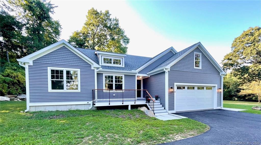 21 Ayers Point Road Old Saybrook, CT 06475 - Photo 1 of 1 a front view of a house with a yard and garage