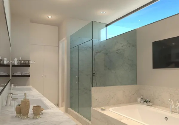 a bathroom with a tub a sink and a shower