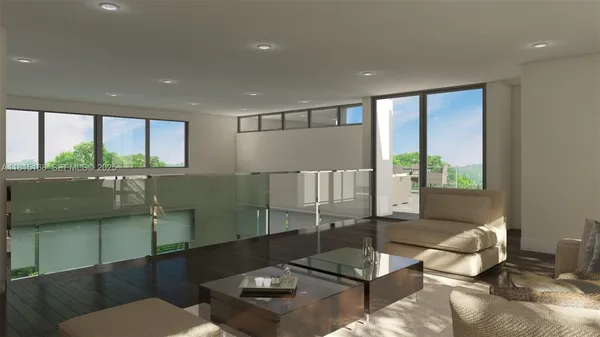 a living room with lots of furniture and a floor to ceiling window
