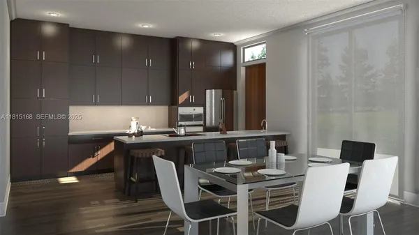 a kitchen with a table chairs sink and cabinets