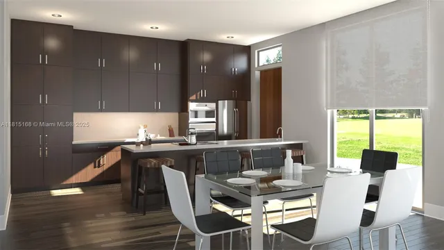 a kitchen with a kitchen island hardwood floor sink stove dining table and chairs