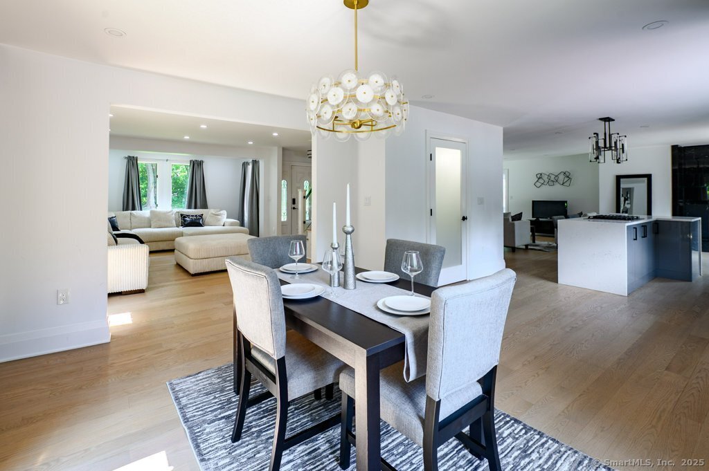 78 Blue Hills Road North Haven, CT 06473 - Photo 12 of 40 a view of a dining room with furniture wooden floor and chandelier