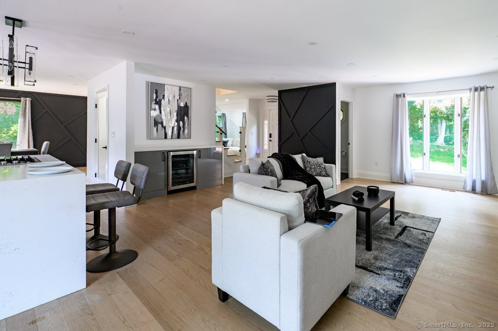 78 Blue Hills Road North Haven, CT 06473 - Photo 33 of 40 a living room with furniture a fireplace and a flat screen tv