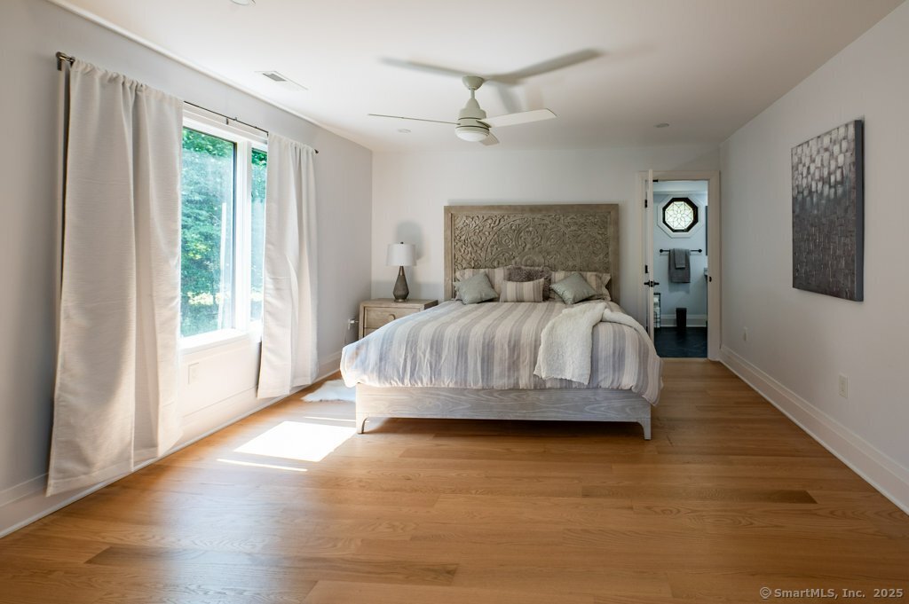 78 Blue Hills Road North Haven, CT 06473 - Photo 5 of 40 a bedroom with a bed and a large window