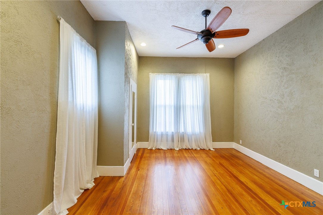 604 St Michael Street Gonzales, TX 78629 - Photo 19 of 37 a view of room with a ceiling fan and window