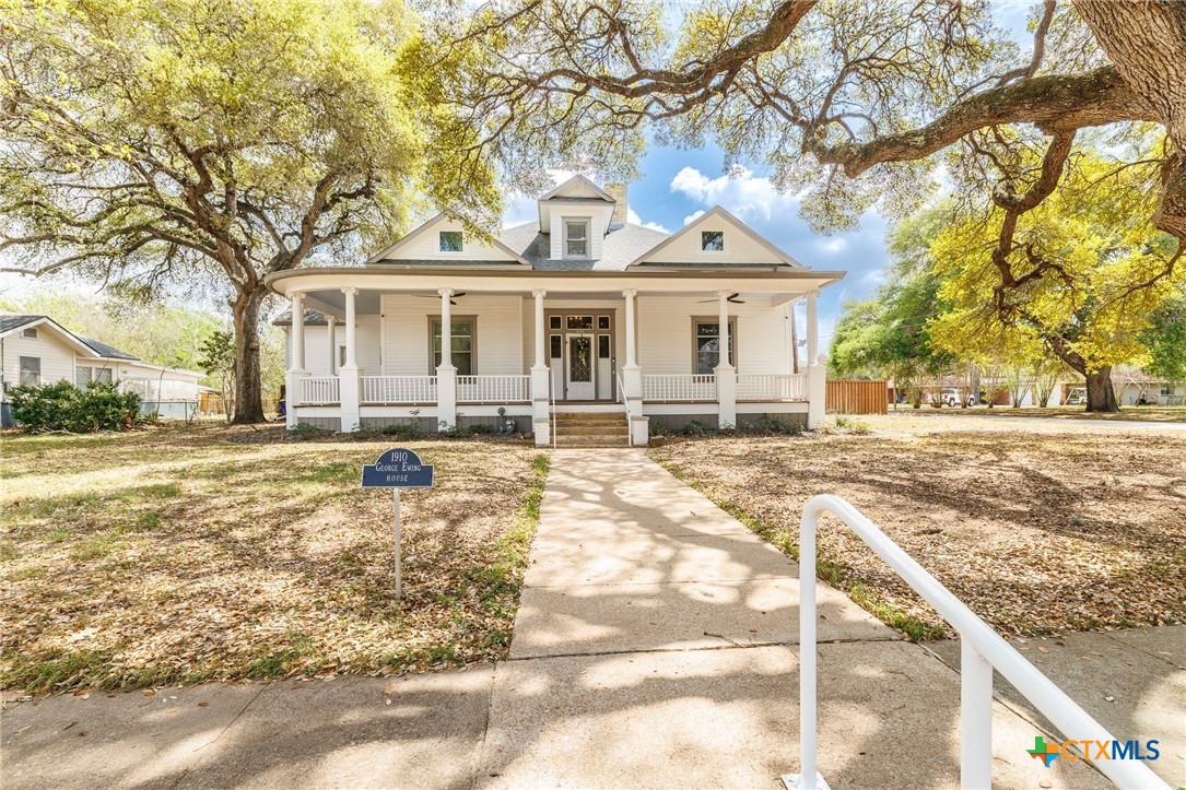 604 St Michael Street Gonzales, TX 78629 - Photo 2 of 37 a front view of a house with a yard
