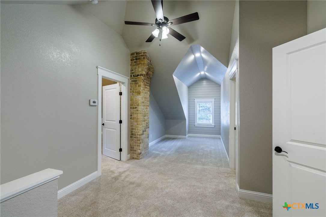 604 St Michael Street Gonzales, TX 78629 - Photo 23 of 37 a view of a livingroom with a chandelier fan