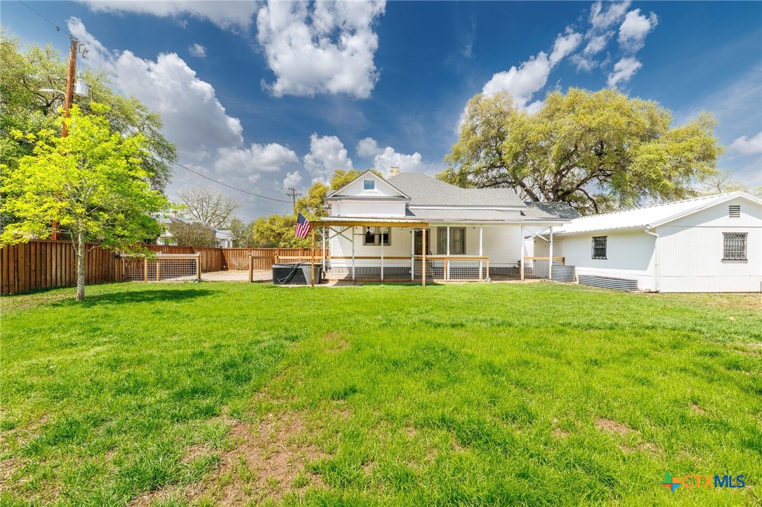 604 St Michael Street Gonzales, TX 78629 - Photo 27 of 37 a view of a house with a backyard