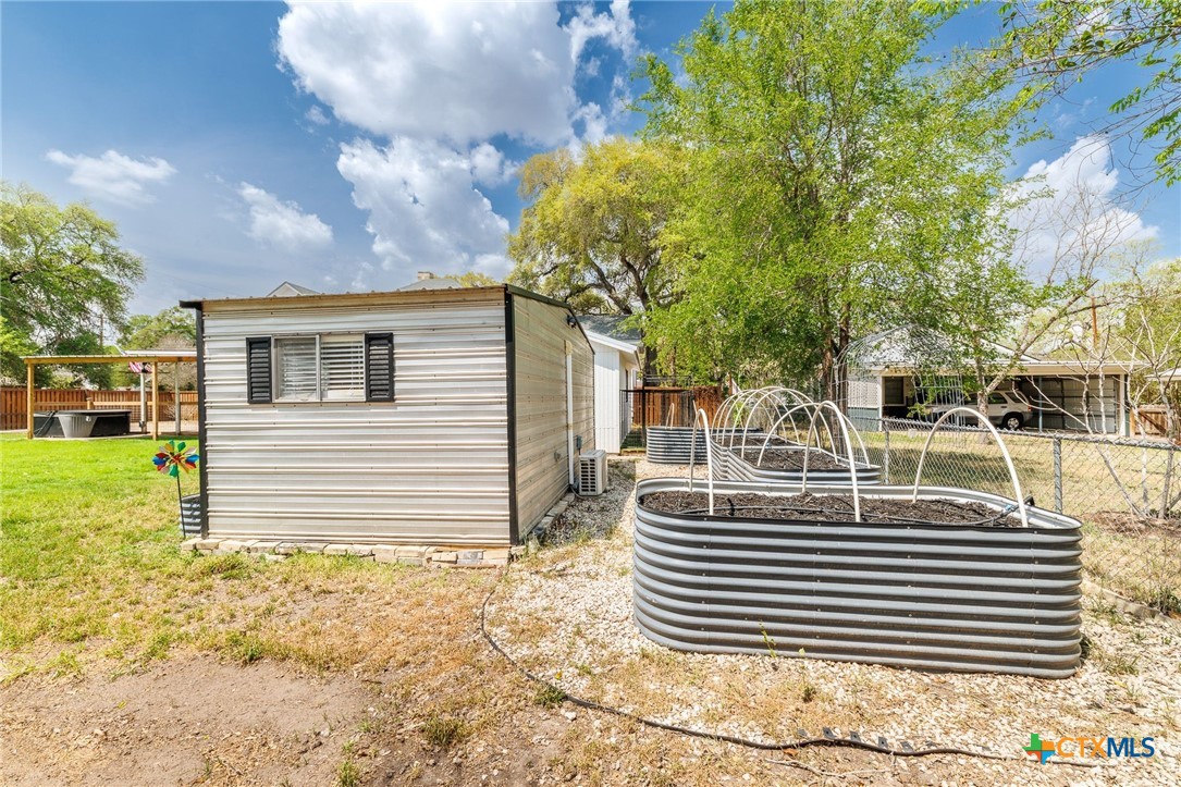 604 St Michael Street Gonzales, TX 78629 - Photo 28 of 37 a view of a house with a yard