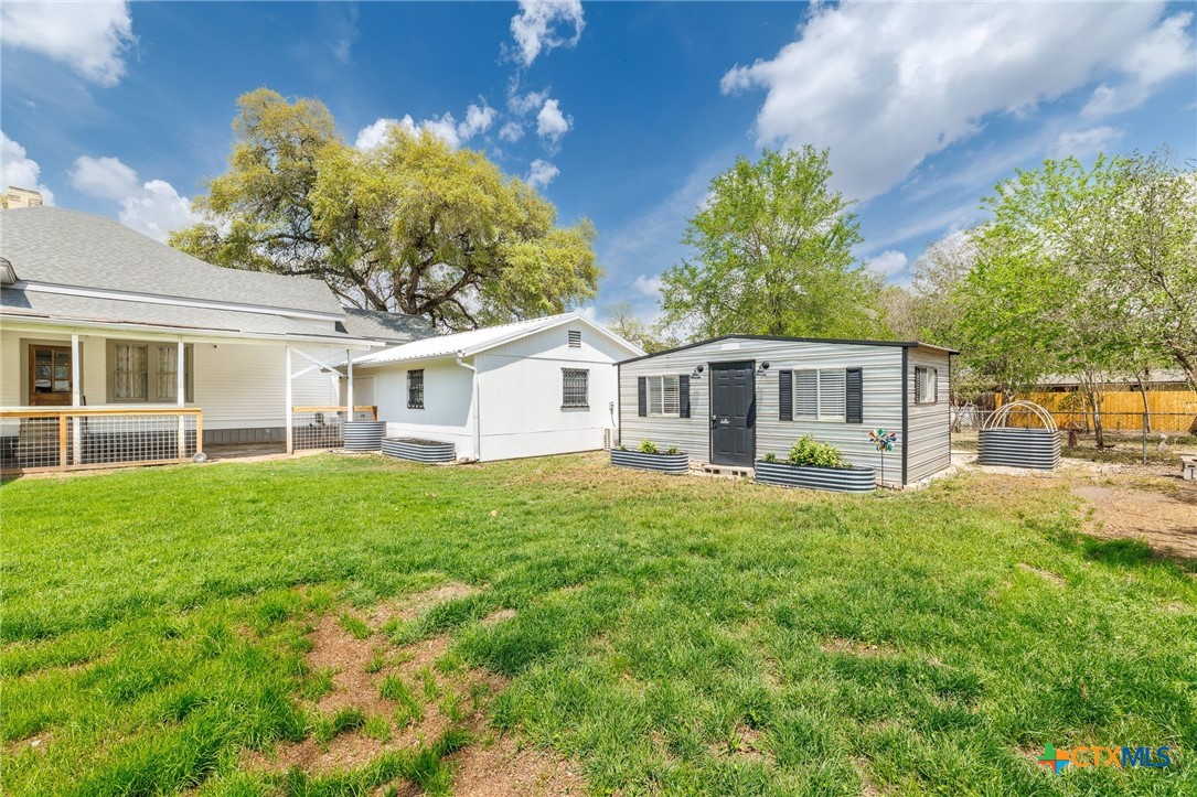 604 St Michael Street Gonzales, TX 78629 - Photo 29 of 37 a front view of house with yard and green space