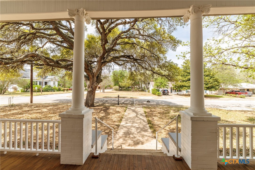 604 St Michael Street Gonzales, TX 78629 - Photo 4 of 37 a view of a yard with street from a tree