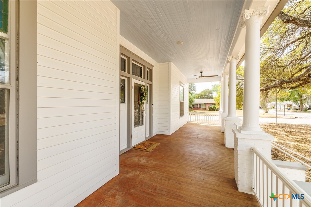 604 St Michael Street Gonzales, TX 78629 - Photo 6 of 37 a view of a hallway with wooden floor and fence