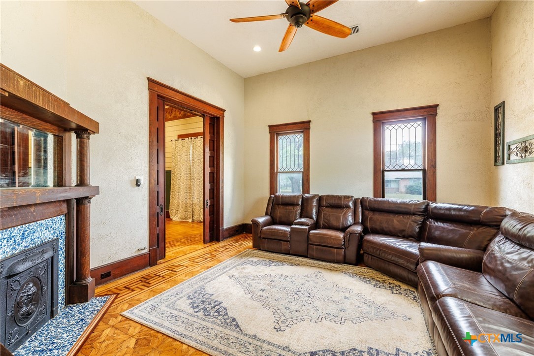 604 St Michael Street Gonzales, TX 78629 - Photo 8 of 37 a living room with furniture and a fireplace