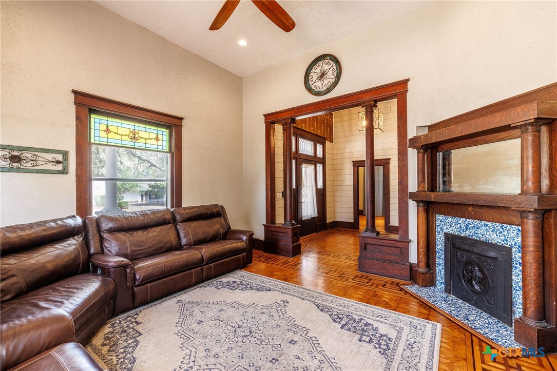 604 St Michael Street Gonzales, TX 78629 - Photo 10 of 37 a living room with furniture and a fireplace