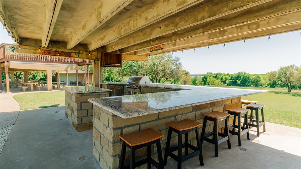175 Tobacco Road Whitney, TX 76692 - Photo 28 of 35 View of patio / terrace featuring exterior kitchen