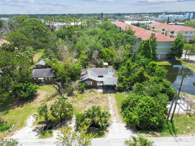 an aerial view of residential house with outdoor space and swimming pool