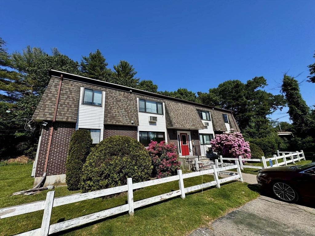 18 Pierce Street, Unit 3B Foxboro, MA 02035 - Photo 17 of 21 a front view of a house with a yard
