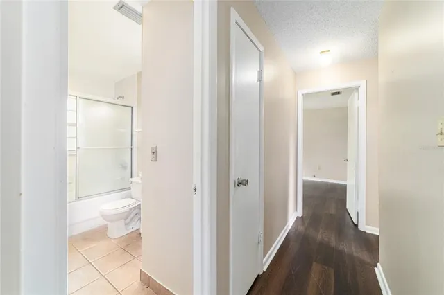 a bathroom with a glass shower door