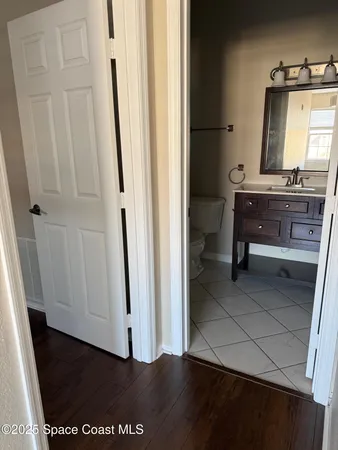 a bathroom with a sink a mirror and a toilet