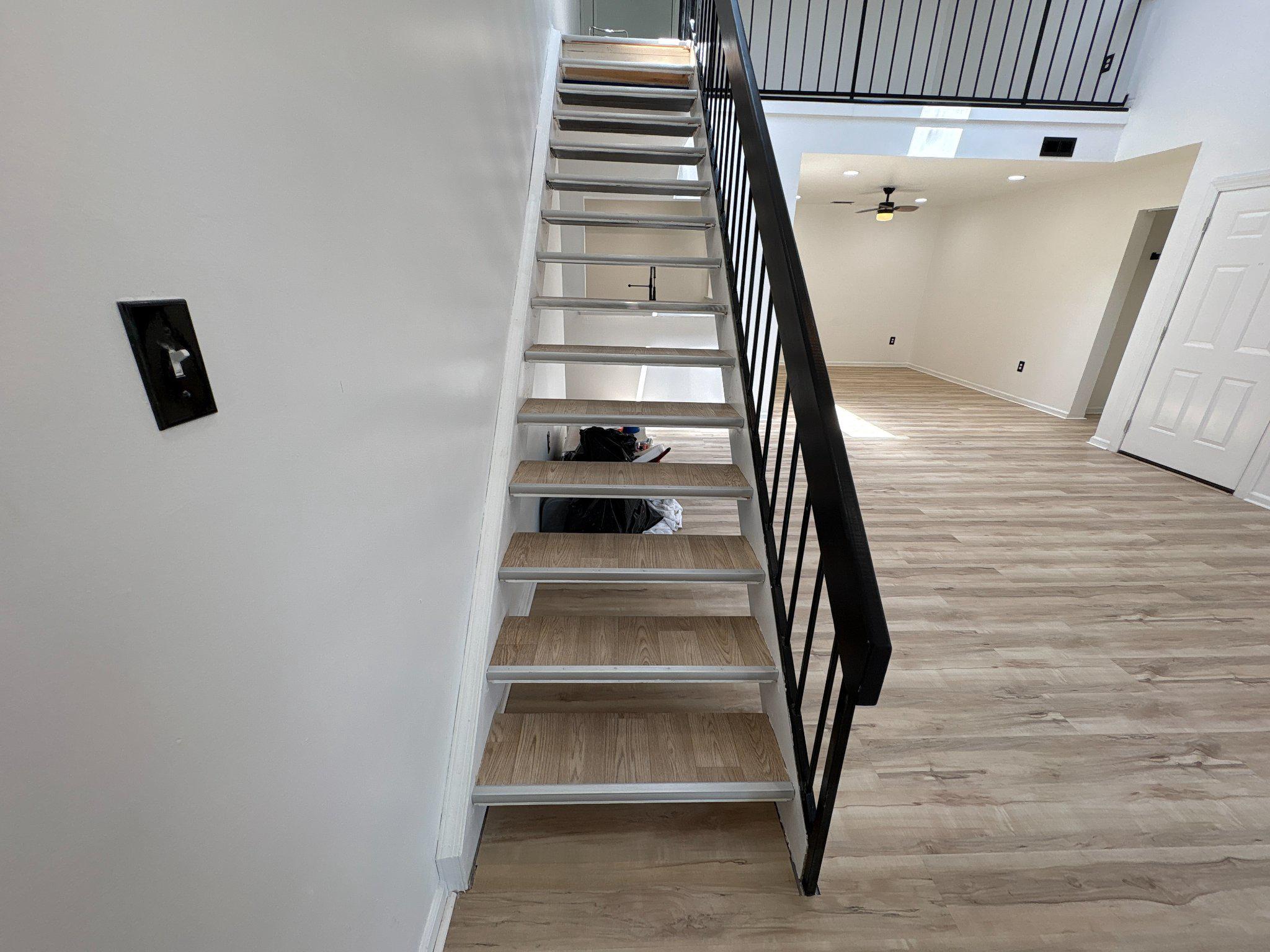 72304 Delaire Landing Road, Unit 304 Philadelphia, PA 19114 - Photo 47 of 56 Modern staircase in bright space.